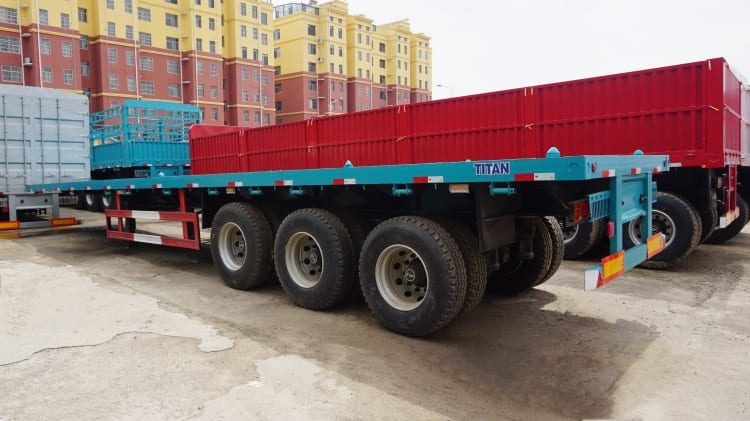 Tri Axle 48ft Flatbed Semi Trailer for Sale with Container Lock