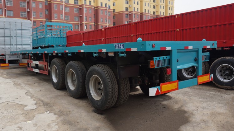 Tri Axle 48ft Flatbed Semi Trailer for Sale with Container Lock